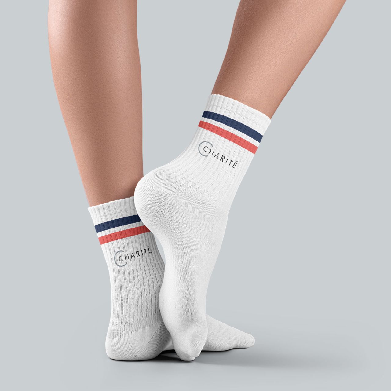 Charité-Socke, weiß, navy und korall